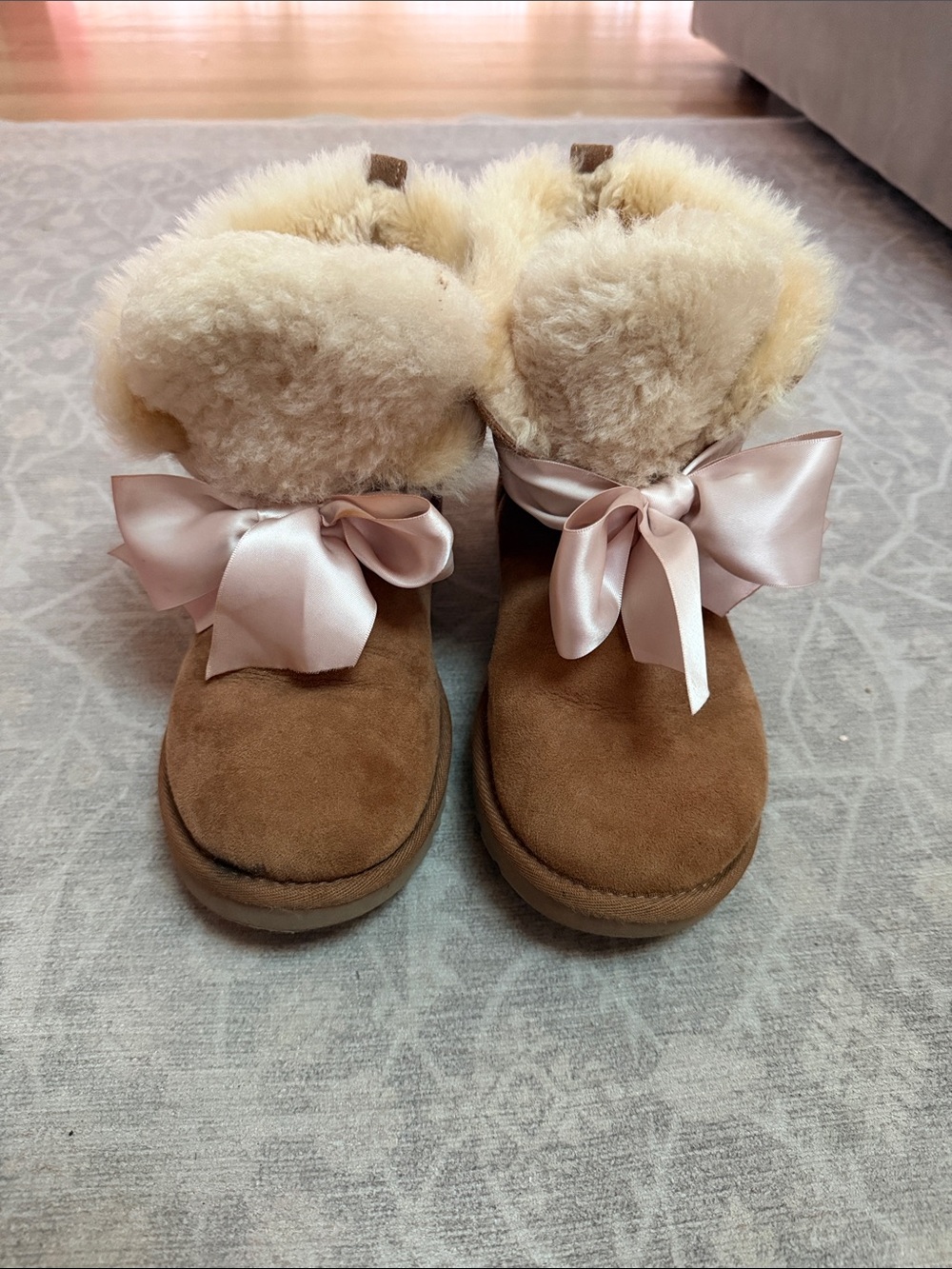 UGG woman’s Chestnut Suede Boots with Pink Satin Bow